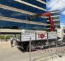 Top Courier refuerza la eficiencia y seguridad en la construcción de Madrid con su flota de camiones grúa